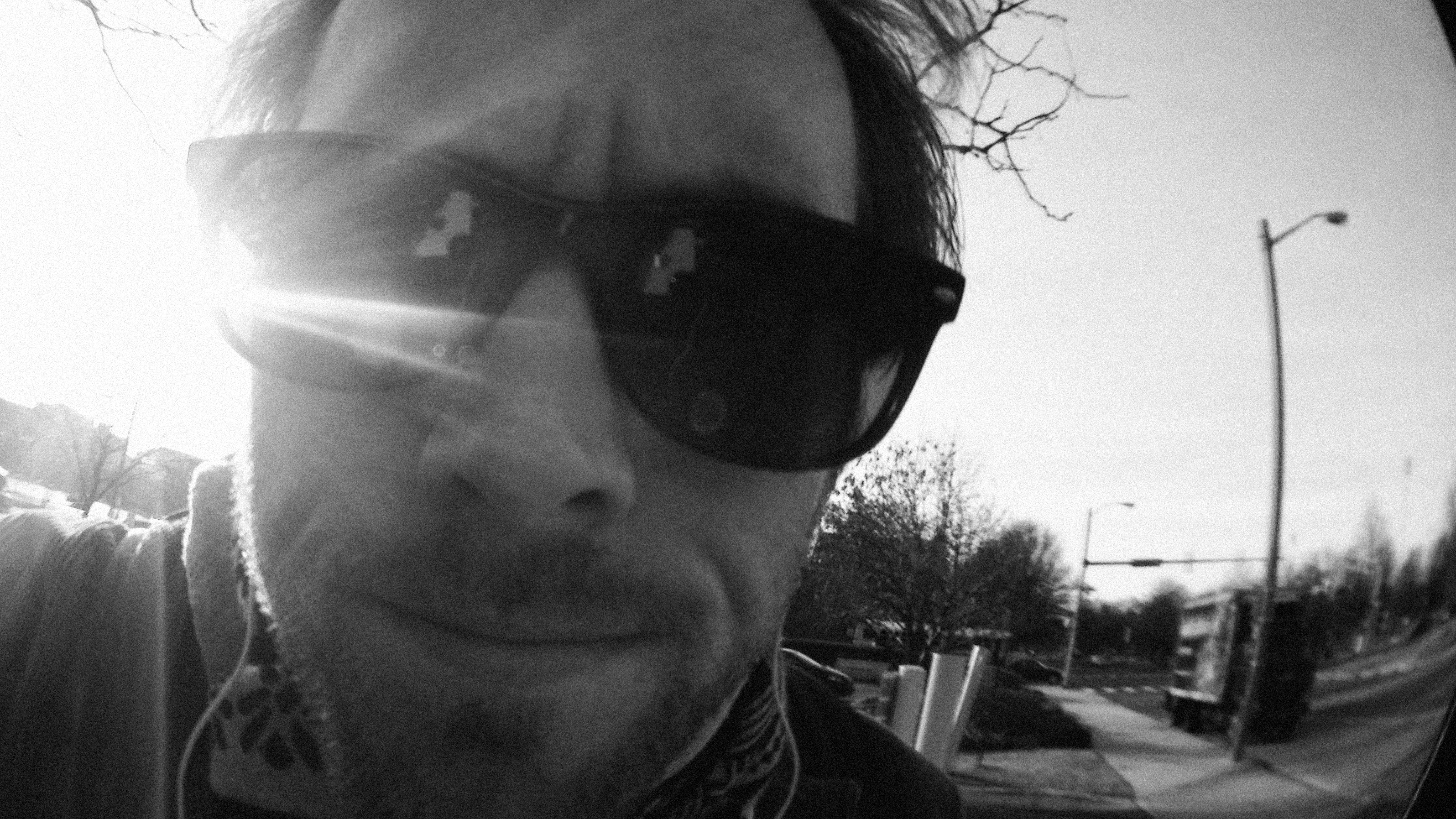 Black-and-white fisheye self-portrait